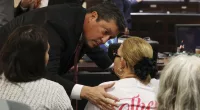 Webb County District Attorney Isidro R. Alaniz comforts victims’ family members ahead of the capital murder trial of former U.S. Border Patrol agent Juan David Ortiz