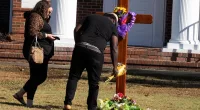 Worshippers lay flowers outside Alabama church after pastor suicide