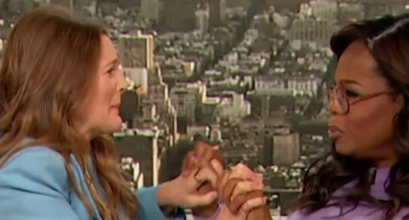 Drew Barrymore blasted for caressing Oprah Winfrey's arm in interview