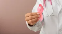 Female Doctor Holding Pink Ribbon Color Background Closeup Breast Cancer — Stock Photo, Image