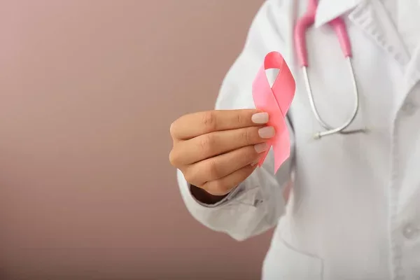 Female Doctor Holding Pink Ribbon Color Background Closeup Breast Cancer — Stock Photo, Image