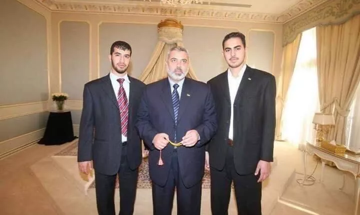 Moaz Haniyeh (pictured right) next to his father reportedly spent thousands on high-end jewellery from 2021-2022 while ordinary Gazans suffered in poverty