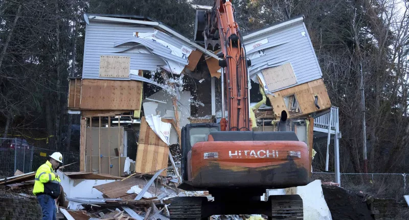 The house of murdered University of Idaho students is demolished by a bulldozer.