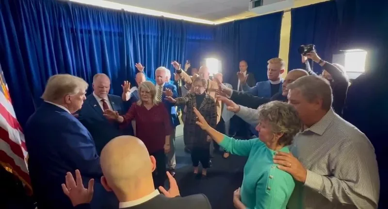 Huge group of MAGA Republicans PRAY over Donald Trump, mobbed in Iowa