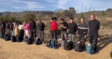 Huge group of men who've escaped Xi's communist regime at US border
