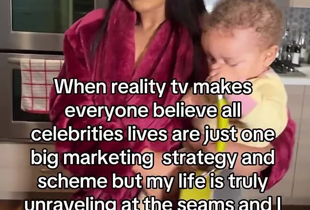 Keke Palmer shared a video to Instagram wearing a maroon robe and holding her nine-month-old son Leodis in her kitchen
