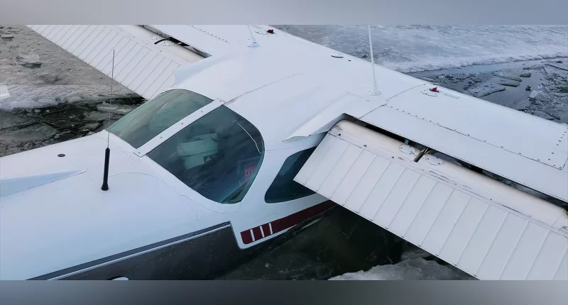 Pilot lands small plane on Minnesota lake, breaks through thin ice