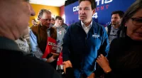 FILE - Republican presidential candidate Florida Gov. Ron DeSantis talks with audience members during a meet and greet, Friday, Nov. 3, 2023, in Denison, Iowa. Former President Donald Trump was the first choice of 51% of likely Iowa caucus participants in a Des Moines Register-NBC News-Mediacom Iowa Poll published Monday, Dec. 11. Florida Gov. Ron DeSantis, who has vowed that he will win Iowa, had the support of 19%. (AP Photo/Charlie Neibergall, File)