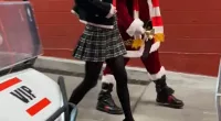 Taylor Swift arrives at Arrowhead on golf cart with Santa Claus