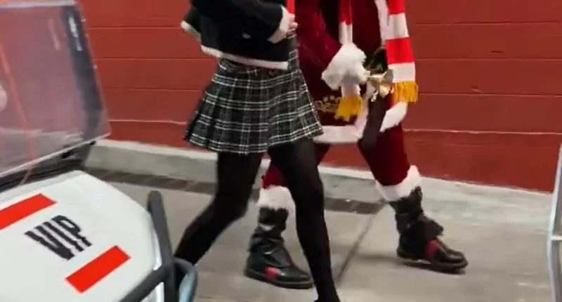 Taylor Swift arrives at Arrowhead on golf cart with Santa Claus