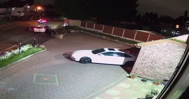 The woman's family arrive home just as the burglar steals the Audi