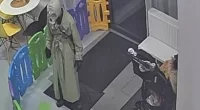 This is the terrifying moment a mystery figure wearing a gas mask walked into a kids play centre