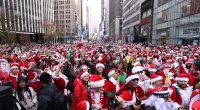 Thousands of Christmas fans dressed as St. Nick take the streets of NY
