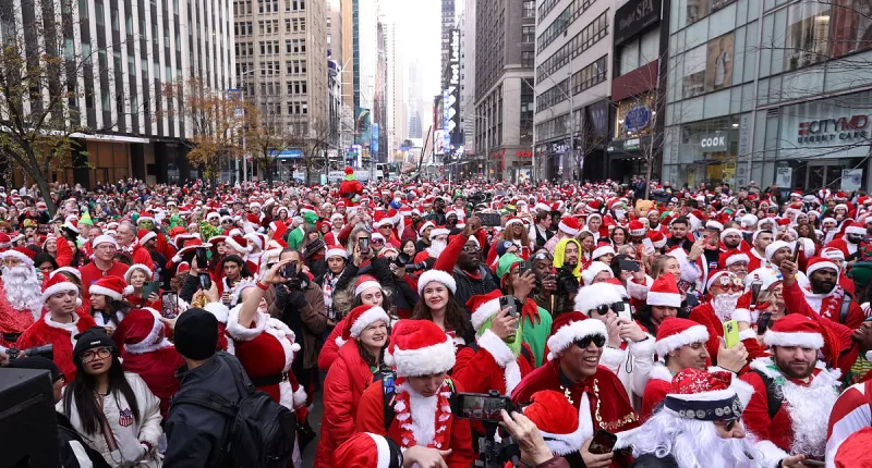 Thousands of Christmas fans dressed as St. Nick take the streets of NY