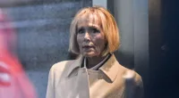 A woman in a trench coat
