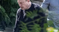 Elon Musk was spotted out in Los Angeles on Thursday looking somber after taking a hit to his net worth
