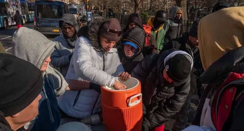 Grim photos show huge line of migrants outside processing center