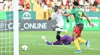 Guinea took a shock lead in bizarre circumstances against Cameroon during the first half of their opening Africa Cup of Nations match on Monday