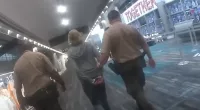 Donna Adelson was escorted out of the airport after getting arrested for her alleged involvement in a murder-for-hire plot