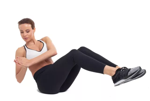woman demonstrating Russian twists