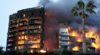 At least four are dead and 14 missing after the huge blaze engulfed to residential buildings in the Spanish city