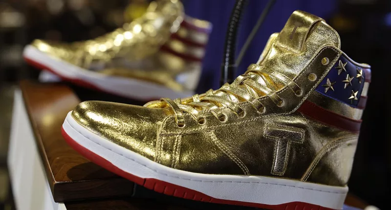 Fox commentator Raymond Arroyo sparks fury by claiming Trump's gold high tops will help win the black vote because 'they love sneakers'
