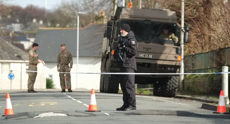 Get out of Plymouth NOW: World watches as army begins nerve-shredding process of carrying live Nazi bomb through streets of Devon city and dropping it into sea after 'largest post-war evacuation' (but just half a mile away, it's time for a pint! )