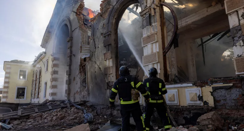 Firefighters work at the scene of a Russian missile strike that destroyed a train station in Kostiantynivka, Ukraine