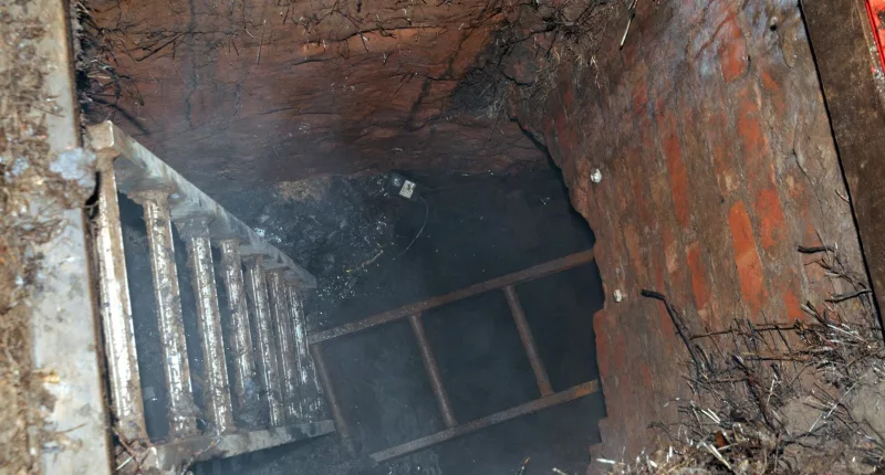 A gang spent months digging a secret tunnel under a car park andinto Blockbuster Video