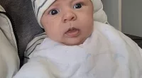 Baby George was born to mum Emily Kelly in a car park