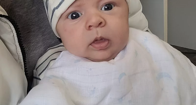 Baby George was born to mum Emily Kelly in a car park