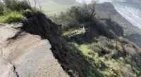 People flee cliffside parking lot as it crashes into ocean