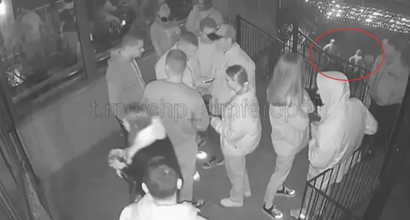 This is the moment Putin's gun-wielding thugs entered the cafe