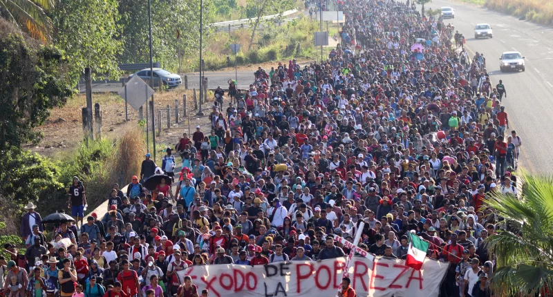 Jason Palmer, a rival Democratic candidate for president, has lashed out at Biden's handling of the migration crisis (Pictured: Migrants heading toward the US on Christmas Eve)