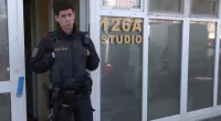 Police stand guard at the crime scene at Asia Studio In Vienna
