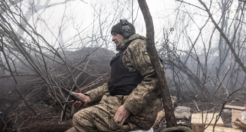 A Ukrainian soldier awaits orders as his country's battle against the invading troops of Vladimir Putin continues