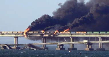 Russia's infamous Kerch Bridge stretching to Crimea pictured burning after a strike by Ukraine