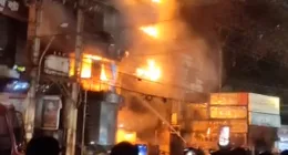 Smoke and flames rise from a multi-storey building on fire, in Dhaka, Bangladesh