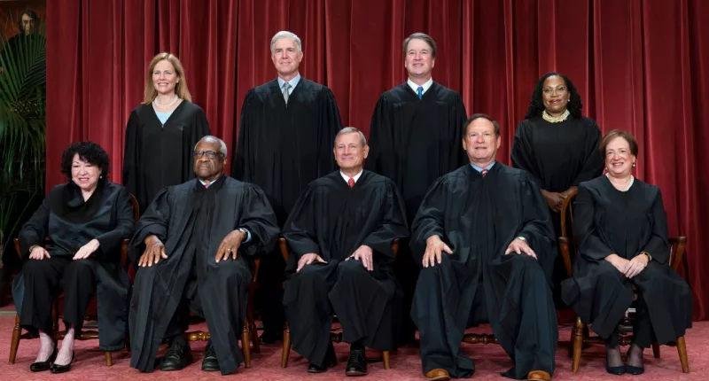 FILE - Members of the Supreme Court sit for a new group portrait following the addition of Associate Justice Ketanji Brown Jackson, at the Supreme Court building in Washington, Oct. 7, 2022. Bottom row, from left, Justice Sonia Sotomayor, Justice Clarence Thomas, Chief Justice of the United States John Roberts, Justice Samuel Alito, and Justice Elena Kagan. Top row, from left, Justice Amy Coney Barrett, Justice Neil Gorsuch, Justice Brett Kavanaugh, and Justice Ketanji Brown Jackson. (AP Photo/J. Scott Applewhite, File)