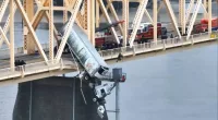 Driver pulled from truck dangling from Louisville bridge over Ohio River in dramatic rescue
