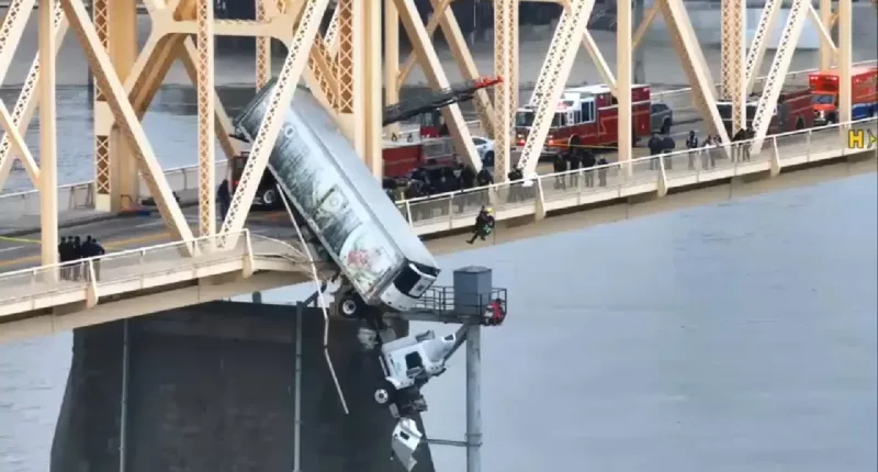 Driver pulled from truck dangling from Louisville bridge over Ohio River in dramatic rescue