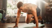 man doing mountain climbers exercise, concept of strength workouts for dad bod