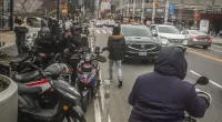 Getting food delivered in New York is simple. For the workers who do it, getting paid is not