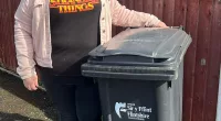 Grandmother Rachel Cain says she has been summoned to a meeting after her bin was only 'slightly' open