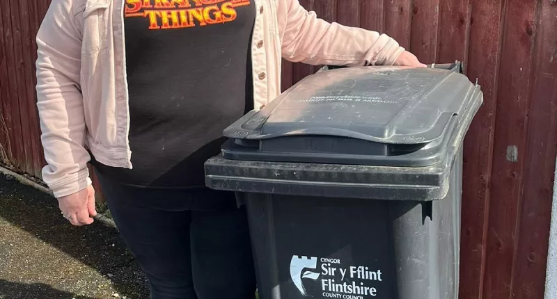 Grandmother Rachel Cain says she has been summoned to a meeting after her bin was only 'slightly' open