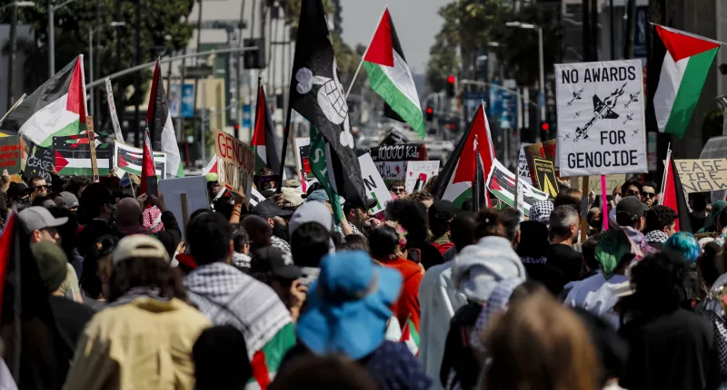Protesters gather during a demonstration in support of Palestinians calling for a ceasefire in Gaza as the 96th Academy Awards Oscars ceremony is held nearby