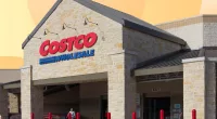 Costco storefront in front of yellow and orange design backdrop