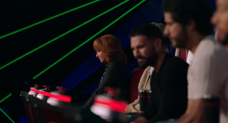 Reba McEntire and the other The Voice Season 25 coaches listen.
