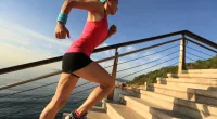 woman doing stair sprints outdoors, concept of high-intensity cardio exercises for weight loss