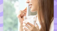 woman taking a supplement